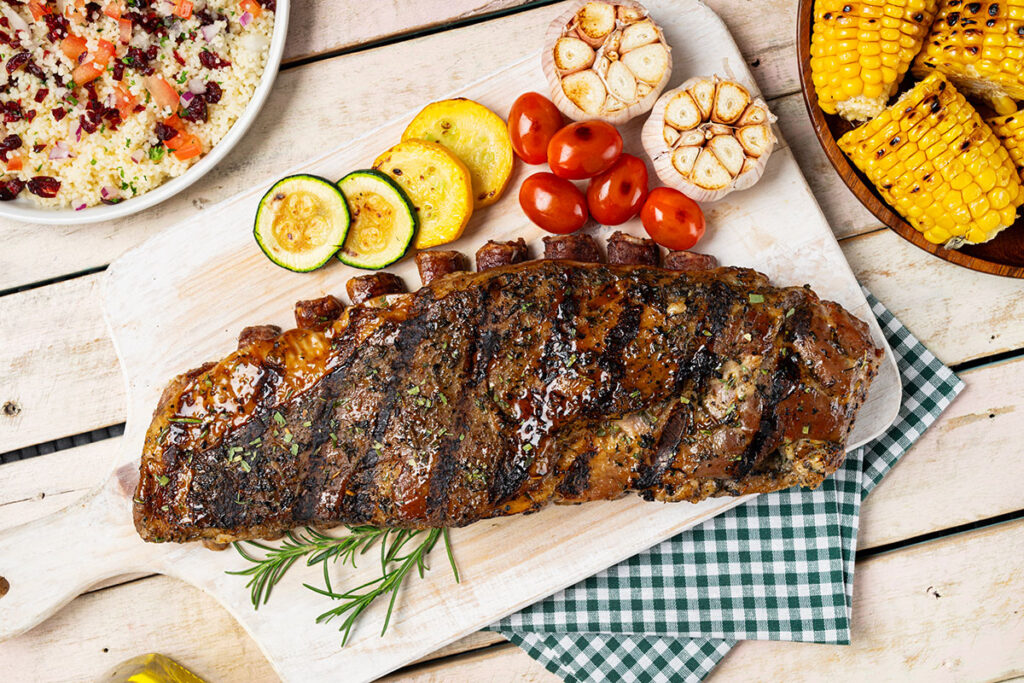 costillas de cordero con ensalada cous cous y choclos asados